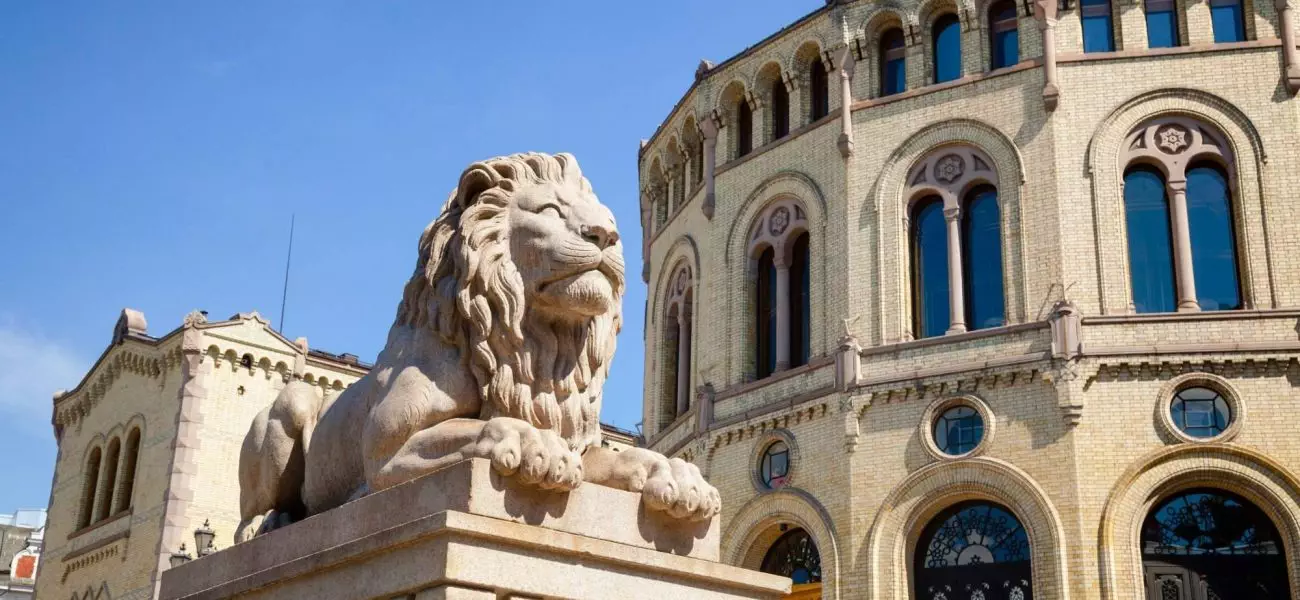 Lion statue at the Storting building (Stortingsbygningen),  the seat of the Storting, the parliament of Norway,  Central Oslo, Norway, Scandinavia