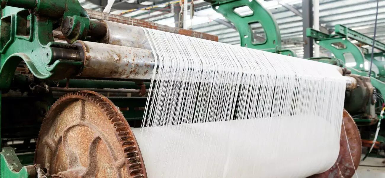 weaving machine produce white cloth.Blue tone map.