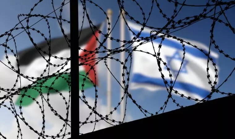 Flags of Israel and Palestine behind the barbed wire