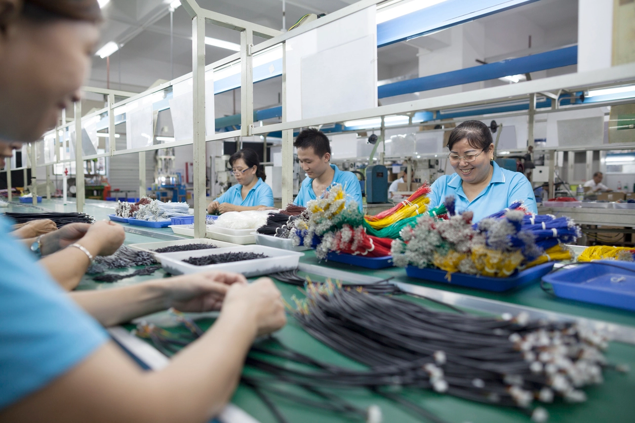 Workers at an electronics factory in Dongguan, China