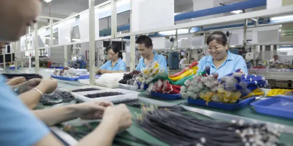 Workers at an electronics factory in Dongguan, China