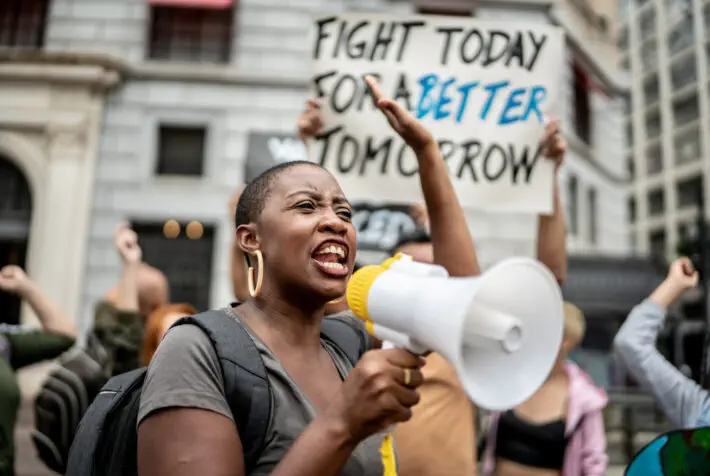 Activists doing a demonstration outdoors