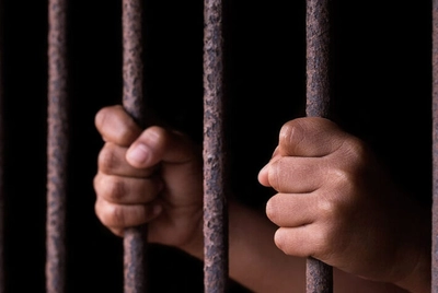 Boy hold cage with eye sad and hopeless